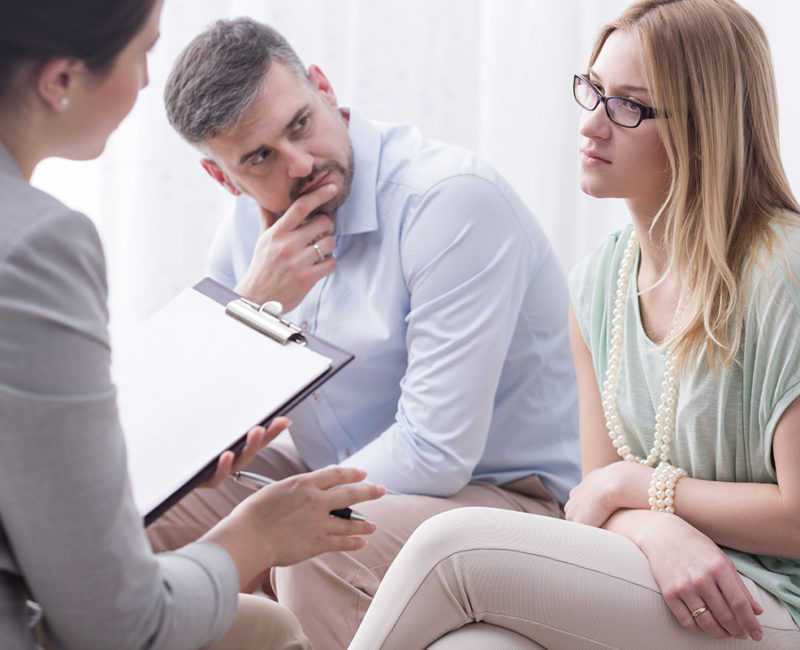 Divorced couple going through a mediation with an attorney in Phoenix